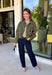 Make a statement everywhere you go with this stunning denim jacket from Veveret. Crafted in a rich olive denim, this standout layer features a breathtaking sheer embroidered floral design across the back, accented with shimmering sequins in shades of green, pink, orange, and brown. Coordinating floral sequin details on the front pockets tie the look together beautifully, while the classic collared neckline and button-front design keep it timeless. 