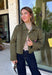 Make a statement everywhere you go with this stunning denim jacket from Veveret. Crafted in a rich olive denim, this standout layer features a breathtaking sheer embroidered floral design across the back, accented with shimmering sequins in shades of green, pink, orange, and brown. Coordinating floral sequin details on the front pockets tie the look together beautifully, while the classic collared neckline and button-front design keep it timeless. 