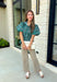 Add a little charm to your everyday wardrobe with this beautifully detailed blouse that's full of fall-inspired style. Featuring hunter green and light blue stripes layered with a neutral floral print, this top offers a fresh take on two timeless patterns. The puff sleeves, button-front design, and elastic drawstring waist create a flattering silhouette that's both comfortable and polished. 
