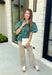 Add a little charm to your everyday wardrobe with this beautifully detailed blouse that's full of fall-inspired style. Featuring hunter green and light blue stripes layered with a neutral floral print, this top offers a fresh take on two timeless patterns. The puff sleeves, button-front design, and elastic drawstring waist create a flattering silhouette that's both comfortable and polished. 
