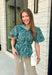 Add a little charm to your everyday wardrobe with this beautifully detailed blouse that's full of fall-inspired style. Featuring hunter green and light blue stripes layered with a neutral floral print, this top offers a fresh take on two timeless patterns. The puff sleeves, button-front design, and elastic drawstring waist create a flattering silhouette that's both comfortable and polished. 