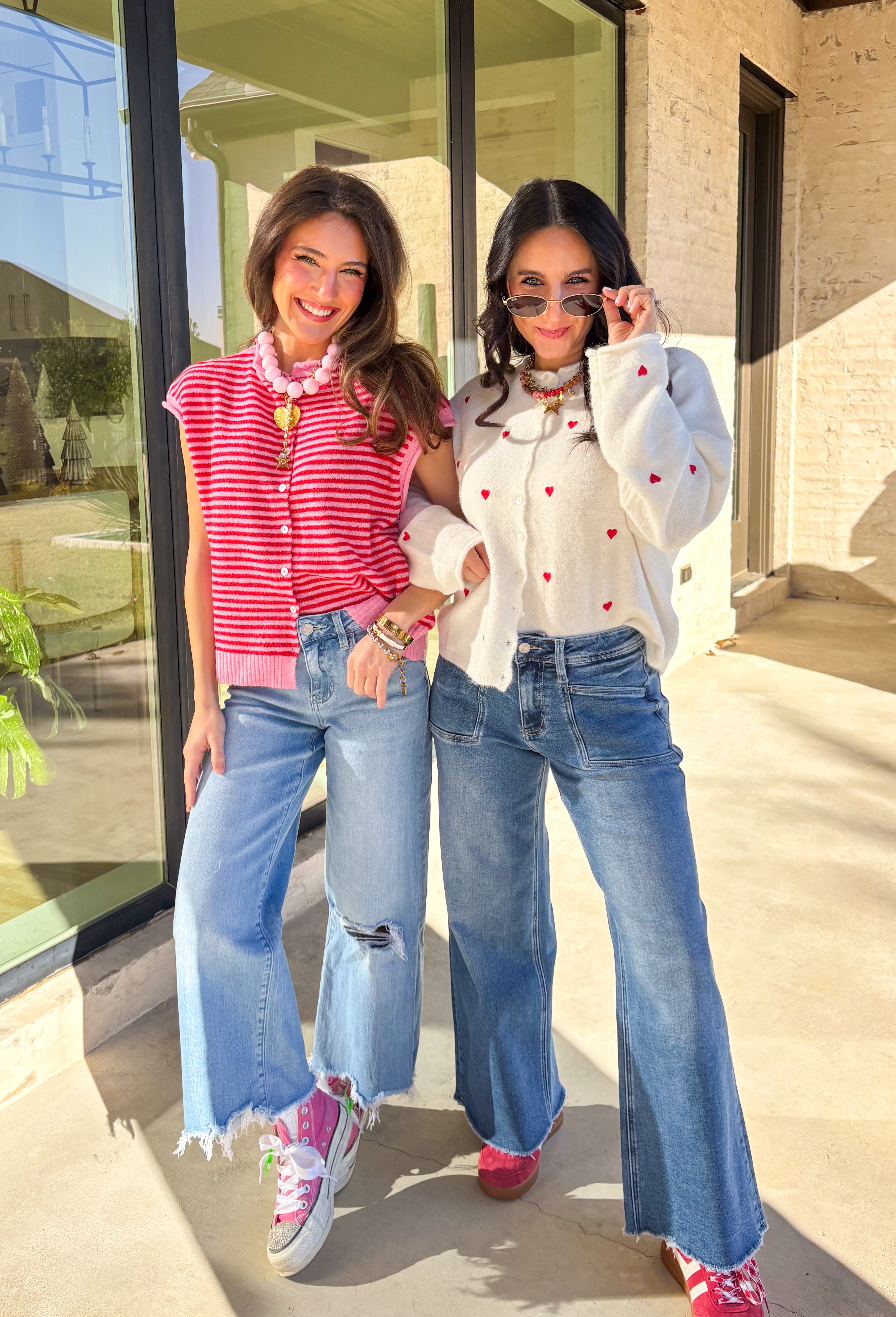Add a little love to your look with this darling white button-down cardigan by Things Between. Featuring red embroidered hearts throughout and a scalloped trim along the front, this cozy knit is the perfect mix of cute and classic. Soft, feminine, and full of charm, it’s the perfect layer for Valentine’s Day and beyond.