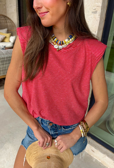 This red stripe tank is the ultimate classic for summer—especially for all your 4th of July plans! The white stripe print keeps it timeless, while the muscle tank style with soft shoulder pads adds that structured, on-trend touch. The elastic hem creates a flattering, easy shape that pairs perfectly with denim or shorts. Made from a lightweight, breathable blend, it’s comfortable enough for all-day wear—from backyard BBQs to fireworks. This is one of those effortless pieces that always looks put together.