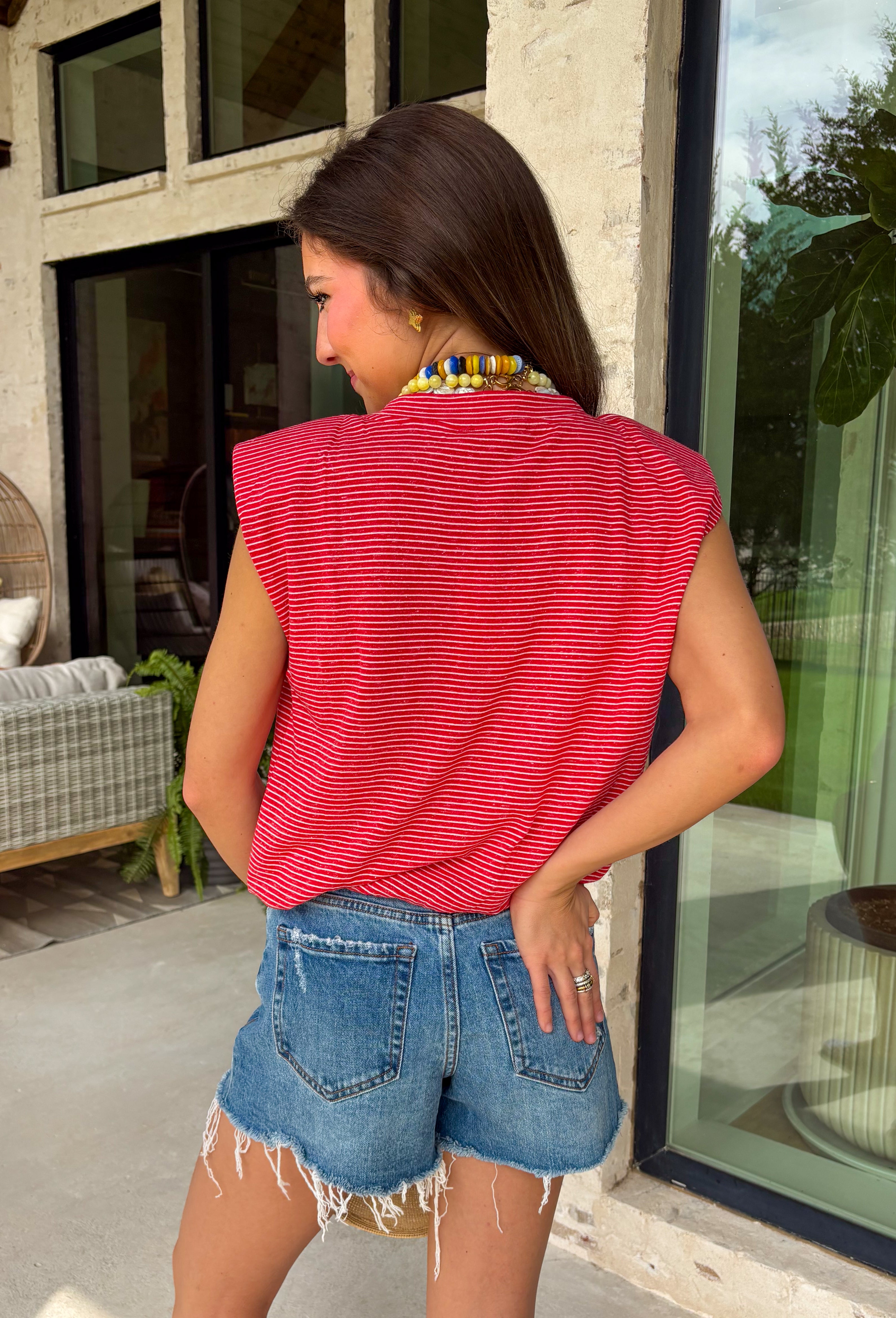 This red stripe tank is the ultimate classic for summer—especially for all your 4th of July plans! The white stripe print keeps it timeless, while the muscle tank style with soft shoulder pads adds that structured, on-trend touch. The elastic hem creates a flattering, easy shape that pairs perfectly with denim or shorts. Made from a lightweight, breathable blend, it’s comfortable enough for all-day wear—from backyard BBQs to fireworks. This is one of those effortless pieces that always looks put together.