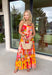 This orange sleeveless midi dress is pure sunshine in outfit form. Covered in a vibrant tropical print with pops of yellow, blue, green, and red, it instantly brings bold, vacation-ready energy to your wardrobe. The adjustable tie straps add a sweet, feminine touch while allowing for a customizable fit. Designed with a flowy tiered skirt and fully lined for easy wear, this dress is made for warm days, beach getaways, and sunny celebrations.
