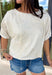 Understated and effortlessly pretty, this khaki short sleeve top is all about the details. The monochromatic floral embroidery adds soft texture without overwhelming the look, giving it that elevated, timeless feel you’ll reach for again and again. Designed with elastic cuff sleeves for a subtle puff effect and finished with a delicate keyhole closure in the back, this top blends feminine touches with everyday ease. The breathable linen blend keeps it lightweight and comfortable.