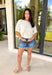 Understated and effortlessly pretty, this khaki short sleeve top is all about the details. The monochromatic floral embroidery adds soft texture without overwhelming the look, giving it that elevated, timeless feel you’ll reach for again and again. Designed with elastic cuff sleeves for a subtle puff effect and finished with a delicate keyhole closure in the back, this top blends feminine touches with everyday ease. The breathable linen blend keeps it lightweight and comfortable.