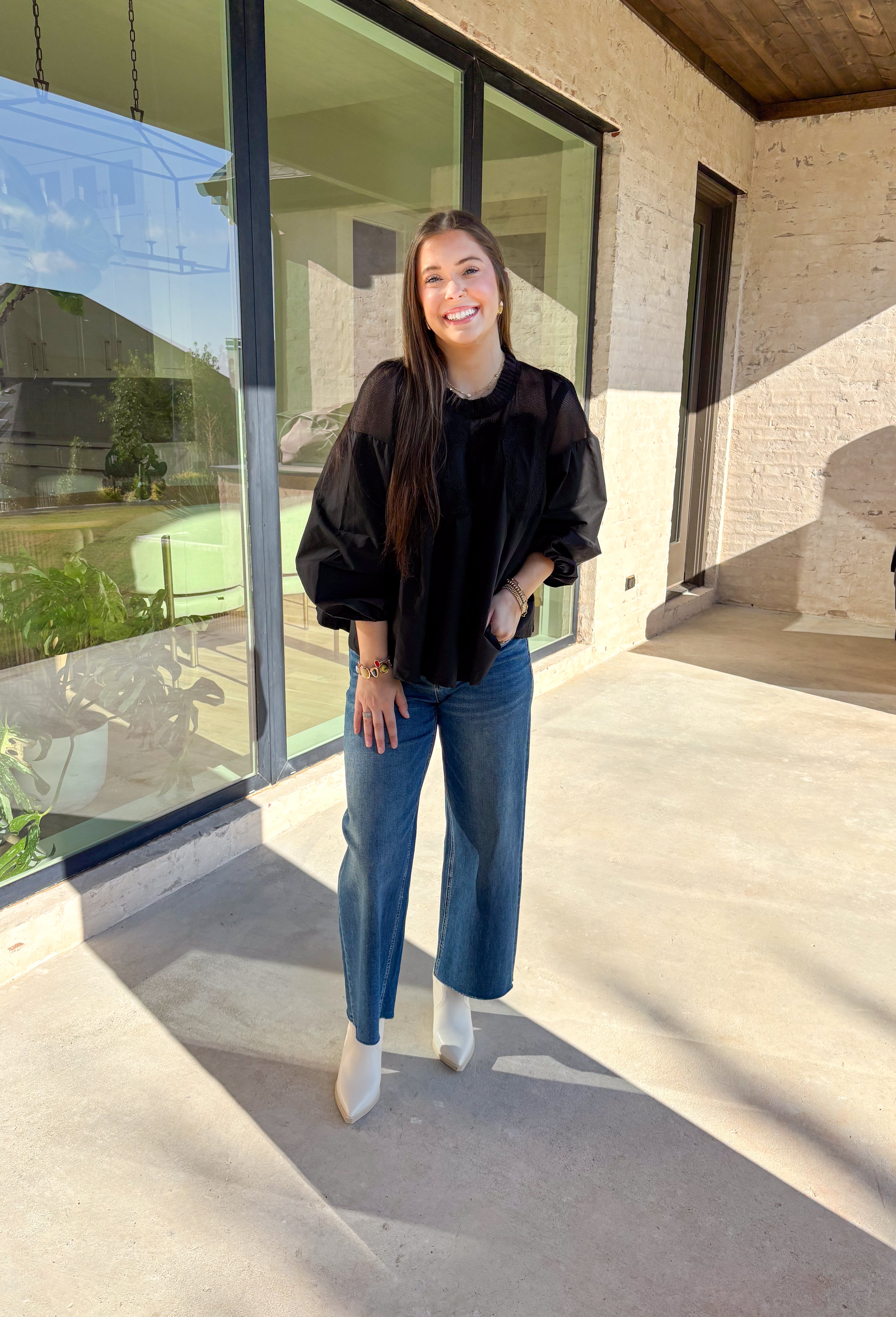 Timeless and elegant, this black long sleeve top by Fate brings a vintage-inspired touch to your winter wardrobe. Featuring balloon sleeves with elastic cuffs and intricate crochet lace detailing along the top, this piece feels effortlessly feminine. The sheer mesh overlay adds just the right hint of texture, making it a perfect choice for date nights, holiday dinners, or any winter occasion.