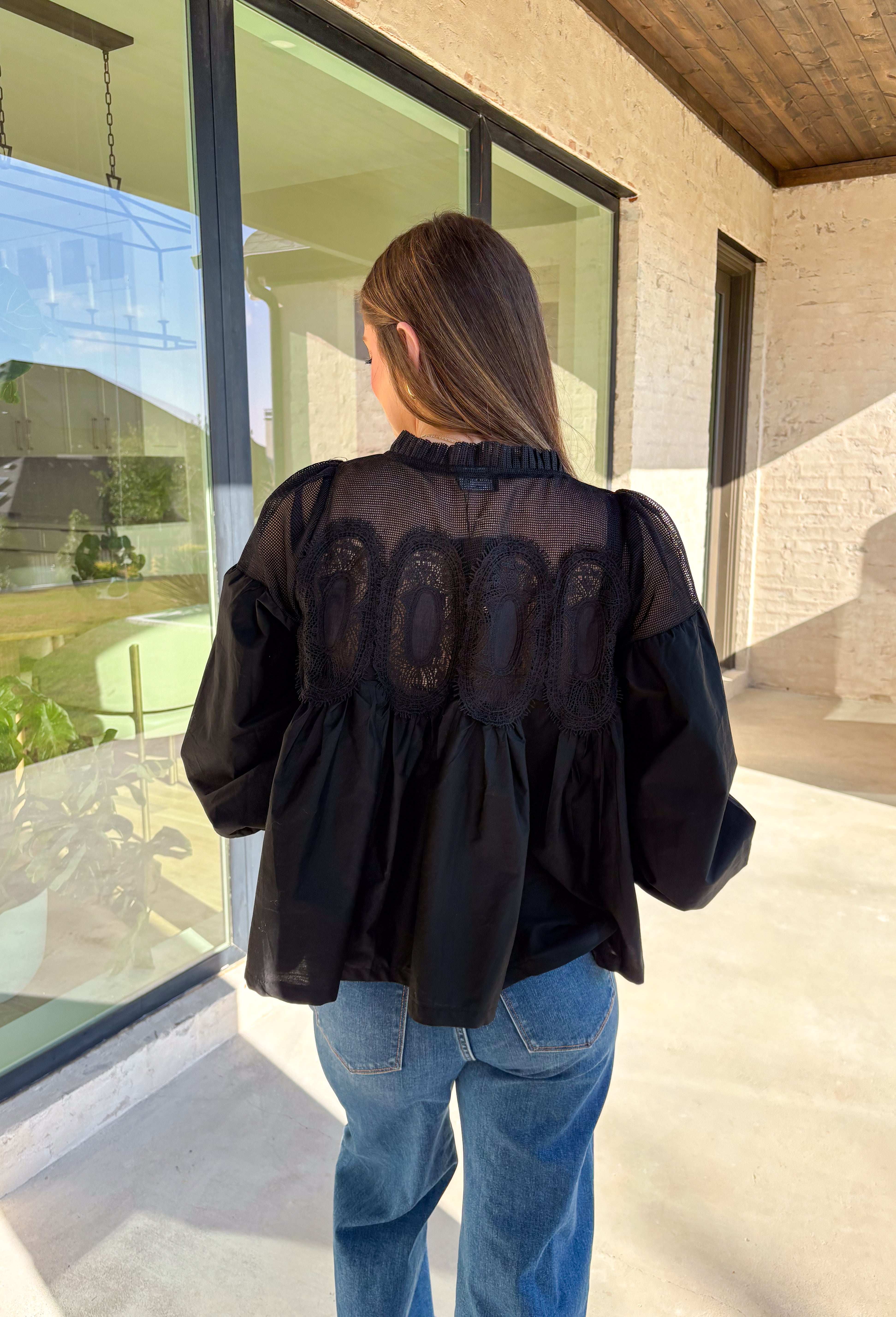 Timeless and elegant, this black long sleeve top by Fate brings a vintage-inspired touch to your winter wardrobe. Featuring balloon sleeves with elastic cuffs and intricate crochet lace detailing along the top, this piece feels effortlessly feminine. The sheer mesh overlay adds just the right hint of texture, making it a perfect choice for date nights, holiday dinners, or any winter occasion.