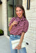 Sweet, polished, and full of charming details, this short sleeve sweater is the perfect way to elevate your fall wardrobe. Featuring pink and brown stripes, this cozy knit combines timeless color with feminine touches you'll love. The self-tie collar adds a playful finish, while the delicate scallop trim and puff sleeves create an effortlessly polished look. Whether you're headed to the office, brunch with friends, or a weekend coffee date, this sweater is an easy favorite you'll reach for all season long.
