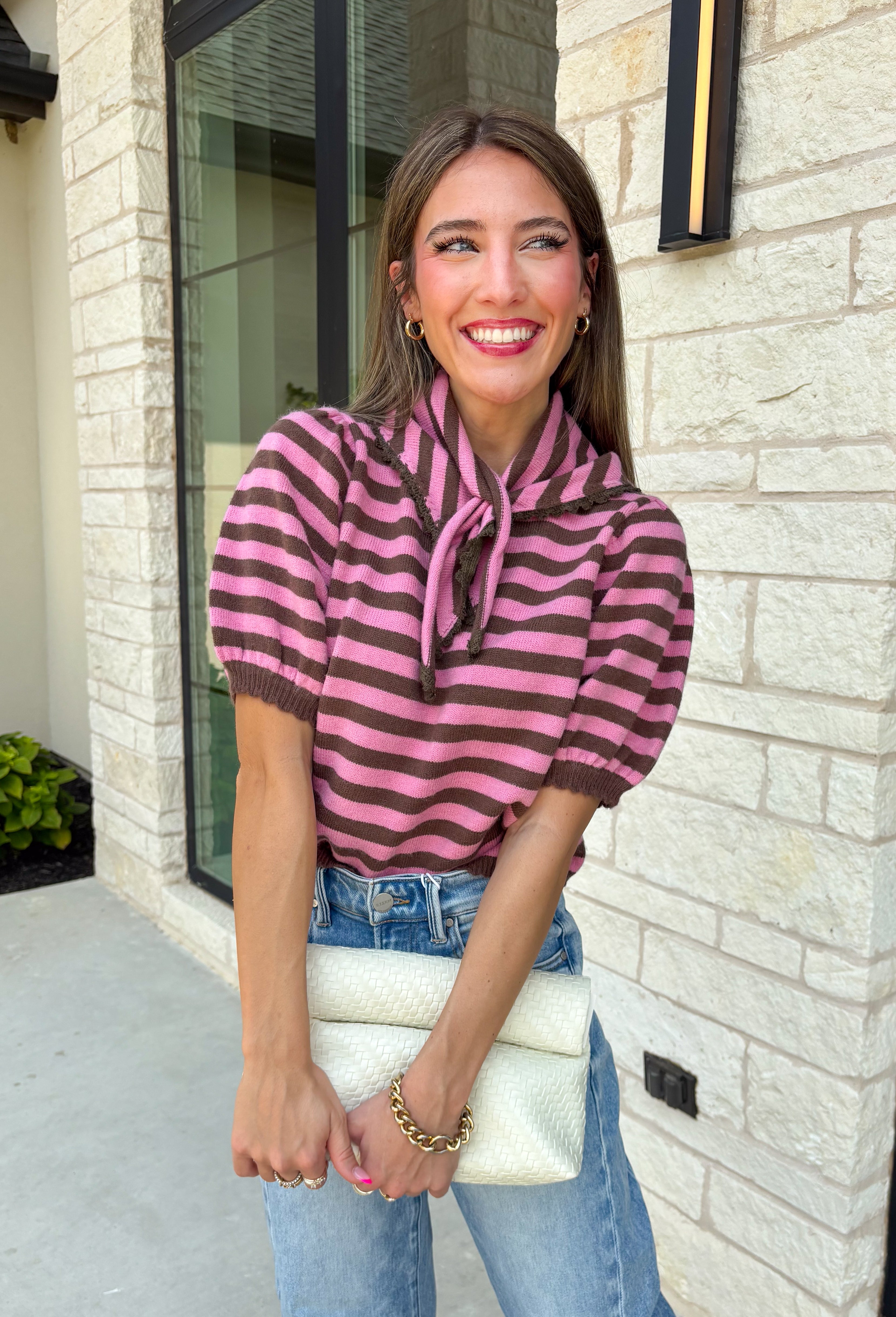 Sweet, polished, and full of charming details, this short sleeve sweater is the perfect way to elevate your fall wardrobe. Featuring pink and brown stripes, this cozy knit combines timeless color with feminine touches you'll love. The self-tie collar adds a playful finish, while the delicate scallop trim and puff sleeves create an effortlessly polished look. Whether you're headed to the office, brunch with friends, or a weekend coffee date, this sweater is an easy favorite you'll reach for all season long.