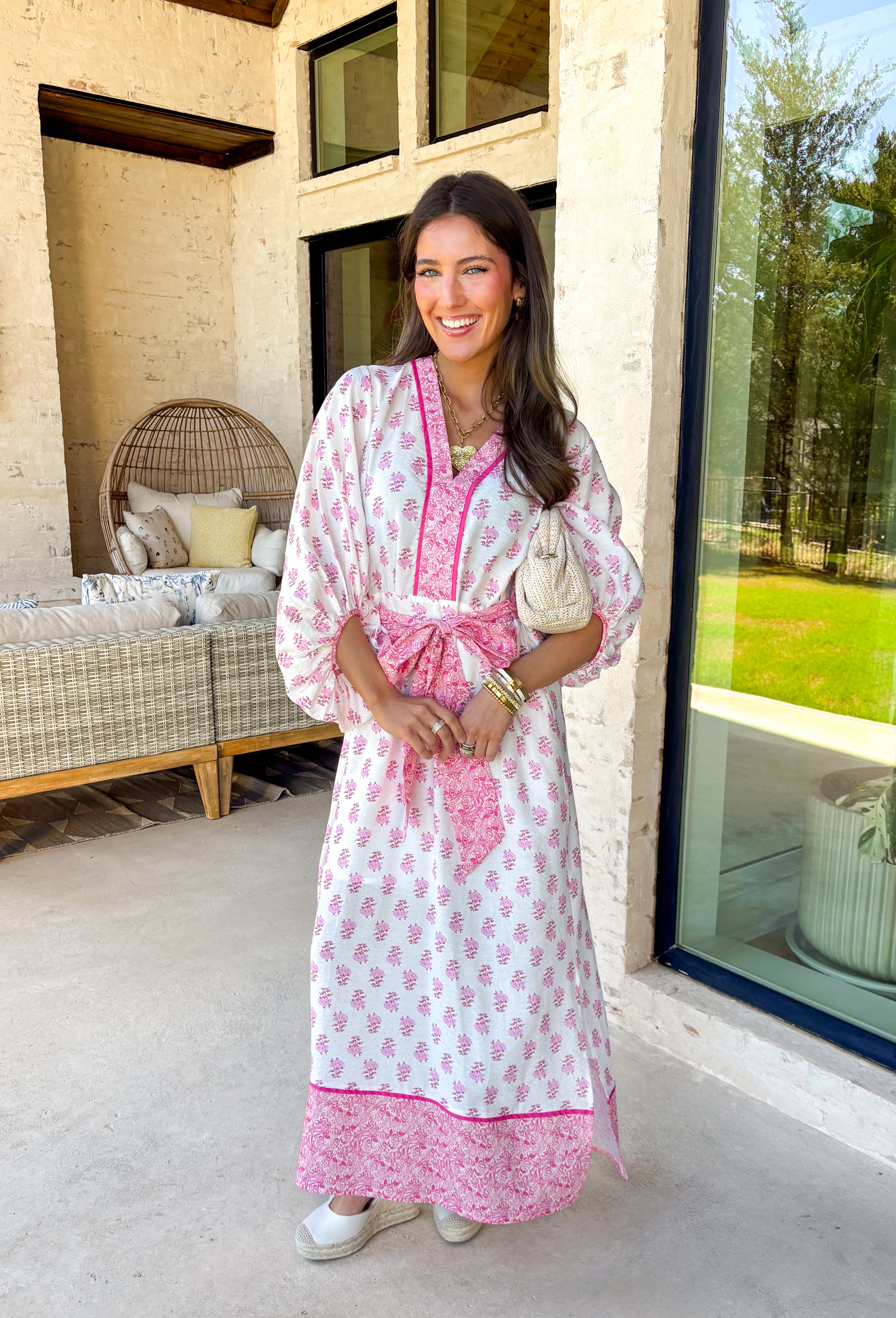 This white floral midi dress by Entro is giving the sweetest spring energy! Covered in a pretty pink floral print, it’s fresh, feminine, and perfect for everything from brunch dates to baby showers. The pink contrast trim adds such a fun pop and gives the dress that extra polished look, while the self-tie detail at the front waist lets you cinch it in for a flattering fit.