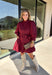 Rich burgundy makes this dress from Entro an easy favorite for all the plans filling up your fall calendar. The stand collar and split neckline create a classic look, while the button-front closure adds a pretty finishing detail. Long balloon sleeves bring soft volume to the silhouette and are finished with button cuffs for a more tailored touch. A removable self-tie belt lets you define the waist or switch up the look, while the tiered skirt adds movement and shape. 
