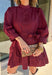 Rich burgundy makes this dress from Entro an easy favorite for all the plans filling up your fall calendar. The stand collar and split neckline create a classic look, while the button-front closure adds a pretty finishing detail. Long balloon sleeves bring soft volume to the silhouette and are finished with button cuffs for a more tailored touch. A removable self-tie belt lets you define the waist or switch up the look, while the tiered skirt adds movement and shape. 