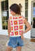 This sleeveless crochet lace embroidered top is bringing all the vibrant, sunshine-ready energy. Designed with a colorful mix of off white, orange, pink, blue, and mustard, it’s the kind of piece that instantly makes an outfit feel fun and fresh. The intricate crochet lace and embroidered details give it that handcrafted look we love, while the button-down front keeps it classic and easy to style. With its cropped length, it pairs perfectly with high-rise denim, skirts, or shorts.