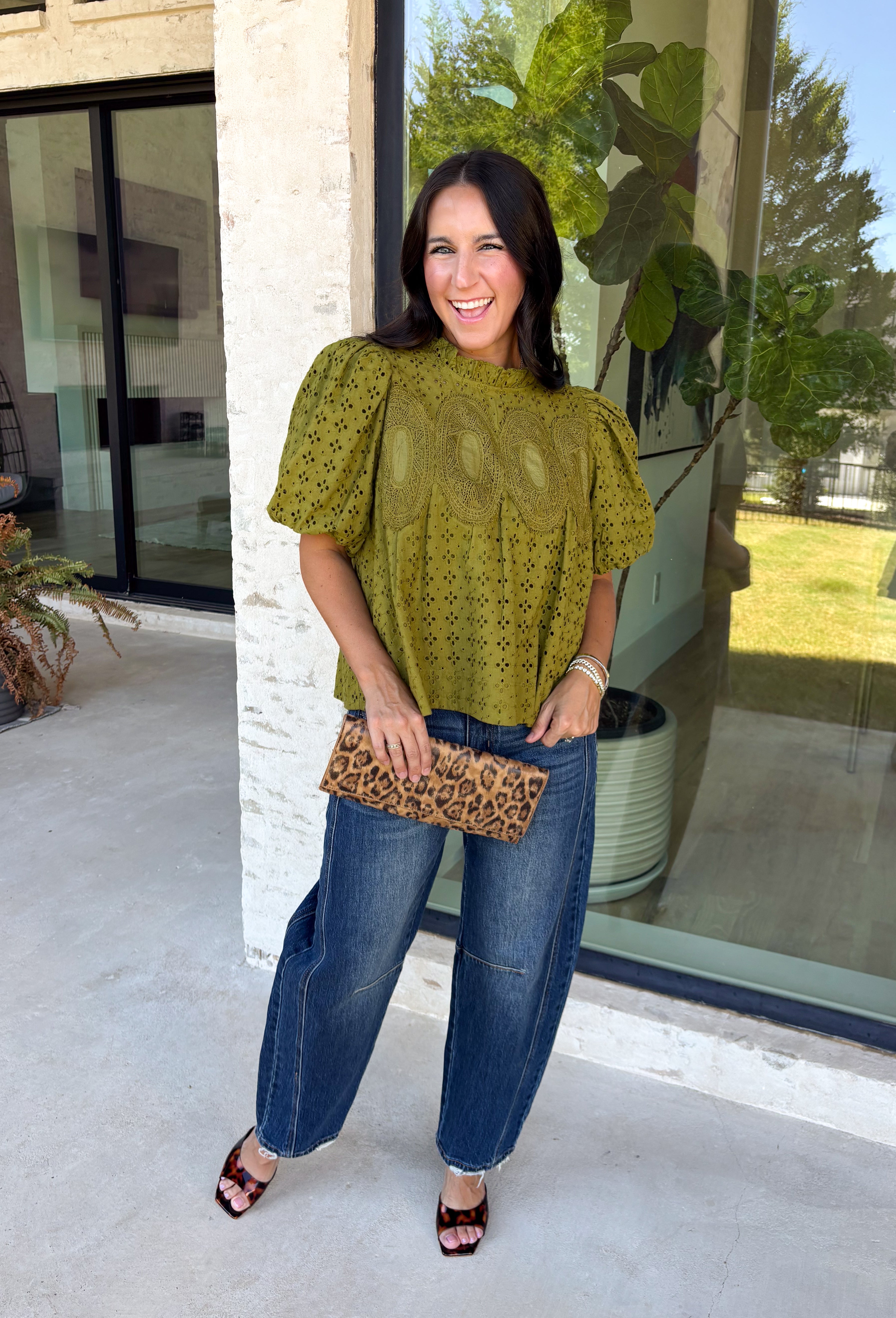 Pretty details make this olive top from Entro one you'll want to work into your fall rotation. The rich olive shade feels perfect for the season, while eyelet detailing and crochet trim add texture and interest to the solid design. A ruffled neckline brings a sweet finishing touch, and short puff sleeves give the silhouette just the right amount of shape. 