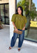 Pretty details make this olive top from Entro one you'll want to work into your fall rotation. The rich olive shade feels perfect for the season, while eyelet detailing and crochet trim add texture and interest to the solid design. A ruffled neckline brings a sweet finishing touch, and short puff sleeves give the silhouette just the right amount of shape. 