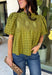 Pretty details make this olive top from Entro one you'll want to work into your fall rotation. The rich olive shade feels perfect for the season, while eyelet detailing and crochet trim add texture and interest to the solid design. A ruffled neckline brings a sweet finishing touch, and short puff sleeves give the silhouette just the right amount of shape. 