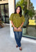 Pretty details make this olive top from Entro one you'll want to work into your fall rotation. The rich olive shade feels perfect for the season, while eyelet detailing and crochet trim add texture and interest to the solid design. A ruffled neckline brings a sweet finishing touch, and short puff sleeves give the silhouette just the right amount of shape. 
