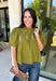 Pretty details make this olive top from Entro one you'll want to work into your fall rotation. The rich olive shade feels perfect for the season, while eyelet detailing and crochet trim add texture and interest to the solid design. A ruffled neckline brings a sweet finishing touch, and short puff sleeves give the silhouette just the right amount of shape. 