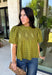 Pretty details make this olive top from Entro one you'll want to work into your fall rotation. The rich olive shade feels perfect for the season, while eyelet detailing and crochet trim add texture and interest to the solid design. A ruffled neckline brings a sweet finishing touch, and short puff sleeves give the silhouette just the right amount of shape. 
