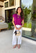 Add a beautiful pop of color to your fall wardrobe with this soft orchid knit top. The rich orchid hue brings a fresh twist to classic autumn styling, making it easy to pair with your favorite dark wash denim, cream trousers, or printed skirts. Designed with a timeless round neckline and flattering cap sleeves, this lightweight knit is perfect for layering under jackets and cardigans as the weather cools. 
