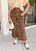 Give your everyday denim a fresh seasonal update with these statement-making wide leg jeans from Entro. Designed in a rich brown hue, these eye-catching pants feature a beautiful neutral floral print with subtle pops of blue for the perfect touch of color. The adjustable self-tie waist creates a flattering, customizable fit, while the wide leg silhouette offers effortless comfort and on-trend style. 