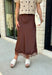 Bring a touch of romance to your fall wardrobe with this stunning chocolate brown satin midi skirt. Crafted from silky satin that catches the light beautifully, this chic skirt is finished with a delicate lace hem for an effortlessly feminine look. The elastic waistband offers all-day comfort while the side zipper creates a flattering, polished fit. Whether you're styling it for holiday gatherings, date nights, or elevating your everyday look, this timeless piece is one you'll love season after season.