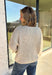 Wrap yourself in all the cozy fall vibes with this chunky knit cardigan! The neutral knit is beautifully accented with subtle orange and black speckles, giving it the perfect autumn-inspired look that's easy to style with everything in your closet. Finished with charming wooden buttons and functional front pockets, this cardigan is made for crisp mornings, pumpkin patch outings, coffee runs, and relaxing weekends. 