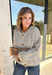 Wrap yourself in all the cozy fall vibes with this chunky knit cardigan! The neutral knit is beautifully accented with subtle orange and black speckles, giving it the perfect autumn-inspired look that's easy to style with everything in your closet. Finished with charming wooden buttons and functional front pockets, this cardigan is made for crisp mornings, pumpkin patch outings, coffee runs, and relaxing weekends. 