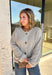 Wrap yourself in all the cozy fall vibes with this chunky knit cardigan! The neutral knit is beautifully accented with subtle orange and black speckles, giving it the perfect autumn-inspired look that's easy to style with everything in your closet. Finished with charming wooden buttons and functional front pockets, this cardigan is made for crisp mornings, pumpkin patch outings, coffee runs, and relaxing weekends. 
