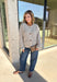 Wrap yourself in all the cozy fall vibes with this chunky knit cardigan! The neutral knit is beautifully accented with subtle orange and black speckles, giving it the perfect autumn-inspired look that's easy to style with everything in your closet. Finished with charming wooden buttons and functional front pockets, this cardigan is made for crisp mornings, pumpkin patch outings, coffee runs, and relaxing weekends. 