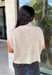 Easy to layer and perfect for those in-between weather days, this oatmeal sleeveless sweater from Day + Moon brings a cozy feel without the extra weight. The soft neutral shade makes it endlessly versatile, while open knit detailing along the front adds texture and gives the simple silhouette a little something extra. A mock neckline adds a classic cold-weather touch, making it especially cute layered under a jacket or cardigan as temperatures start to drop. 