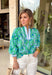 Fresh, bright, and made for spring days, this green long sleeve top by Entro is an easy statement piece you’ll reach for on repeat. Featuring a beautiful blue floral print throughout, it brings a cheerful pop of color while still feeling classic and wearable. The light blue and white contrasting band along the front adds a fun touch of detail that gives it a little extra something. Made from breathable cotton, it’s perfect for those in-between spring days when you want coverage without feeling heavy.
