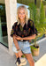 This black floral top is such a fun, vibrant pick for summer! The colorful mix of yellow, orange, purple, and green pops beautifully against the black base, making it an easy statement piece. The scalloped neckline and hem add the sweetest feminine detail, while the puff sleeves with elastic give it that flattering, easy shape. Lightweight and breathable in 100% cotton, it’s perfect for warm days when you still want to feel put together. 