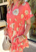 Bright, cheerful, and full of charm! This coral short sleeve dress features a bold neutral floral print with a soft pop of baby blue that makes the pattern feel extra fresh. The vibrant coral base gives it a warm, sunny feel that’s perfect for the season. Designed with a classic collared neckline and a flattering tiered silhouette, this dress blends structure with easy movement. The lightweight cotton fabric keeps it breathable and comfortable, while side pockets add that everyday practicality we love.