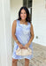 Fresh, sweet, and made for sunny spring days, this light blue sleeveless mini dress by Entro is an easy favorite. Featuring an off-white botanical print throughout, it gives that clean, airy look that feels perfect for the season. The straight neckline keeps it simple and flattering, while the back zipper closure makes it easy to slip on and go. Fully lined and finished with side pockets (because we love a practical moment), this dress is perfect for brunch, showers, and weekend plans.