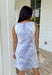 Fresh, sweet, and made for sunny spring days, this light blue sleeveless mini dress by Entro is an easy favorite. Featuring an off-white botanical print throughout, it gives that clean, airy look that feels perfect for the season. The straight neckline keeps it simple and flattering, while the back zipper closure makes it easy to slip on and go. Fully lined and finished with side pockets (because we love a practical moment), this dress is perfect for brunch, showers, and weekend plans.
