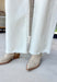 Meet the jeans you'll style with everything this season! These cream tummy control wide leg jeans are the perfect combination of flattering fit and everyday comfort. Designed with Risen's signature tummy control panel, they offer a smooth, supportive silhouette while maintaining all-day comfort. Crafted from clean, classic cream denim with warm tan stitching throughout, they're finished with a modern wide leg and raw hem for a timeless look you'll wear on repeat. 