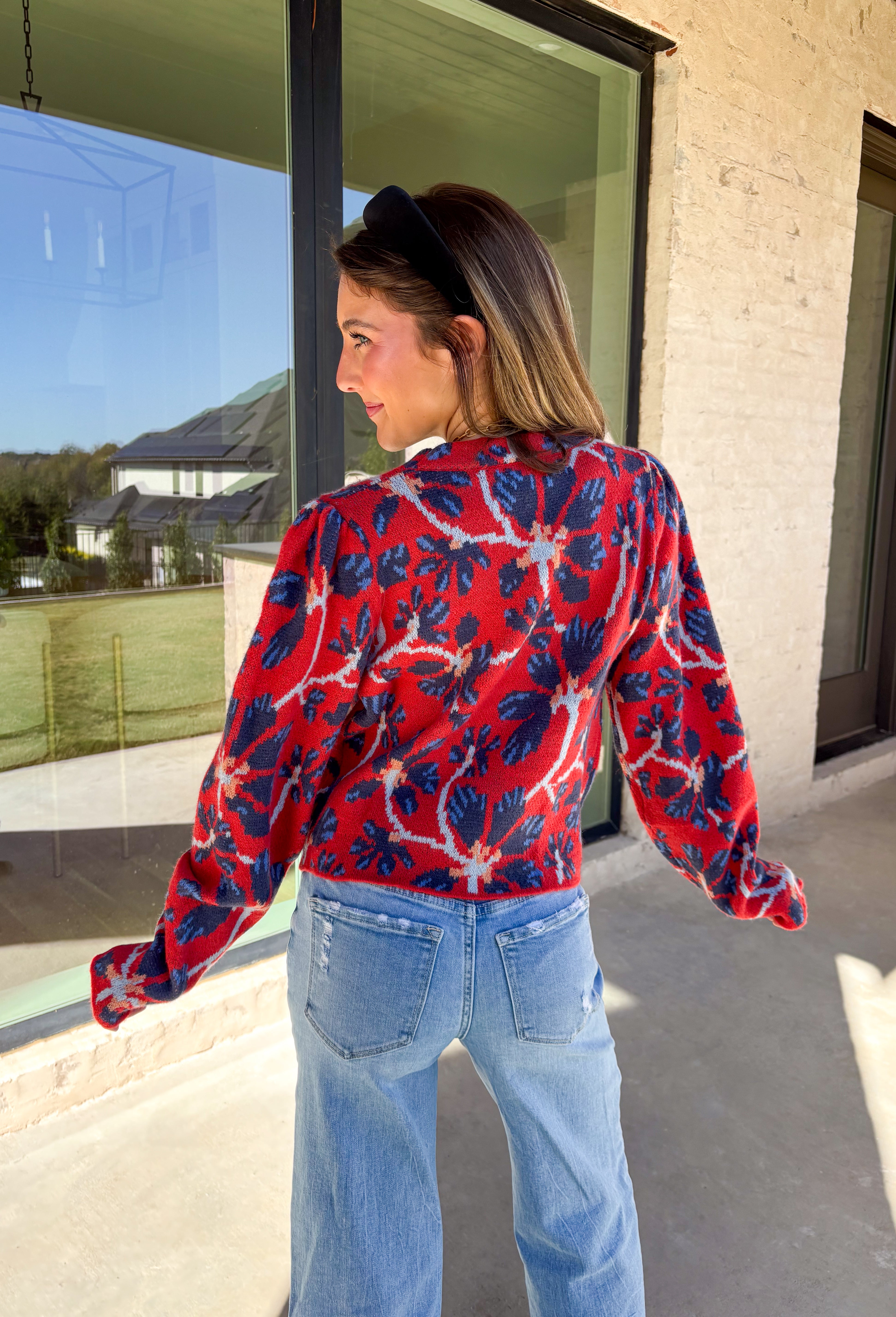 Make a statement this season in this red cropped sweater featuring an eye-catching abstract blue floral print. The cozy knit keeps you warm while the mock neck adds a touch of chic structure. With its cropped length, this sweater pairs effortlessly with high-rise jeans, skirts, or trousers—perfect for when you want comfort without sacrificing style.