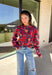 Make a statement this season in this red cropped sweater featuring an eye-catching abstract blue floral print. The cozy knit keeps you warm while the mock neck adds a touch of chic structure. With its cropped length, this sweater pairs effortlessly with high-rise jeans, skirts, or trousers—perfect for when you want comfort without sacrificing style.