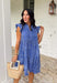 Easy, breezy, and full of tropical charm! This blue short sleeve tiered dress features a beautiful white embroidered leaf print that gives it that fresh, getaway-ready feel. The flowy tiered silhouette adds movement and comfort, making it perfect for warm spring days. Finished with embroidered trim on the sleeves for an extra touch of detail, this dress blends relaxed style with a polished look. 