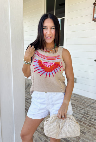 Meet your new golden hour favorite! This neutral sweater tank features a dreamy abstract sun print in shades of pink, orange, and purple — the prettiest pop of color against a soft, wearable base. It’s bold enough to stand out, yet neutral enough to pair with just about anything. Cable knit texture throughout adds cozy dimension, while the open knit detailing along the hem and top keeps it lightweight and breathable. Finished with scalloped edges along the sleeves and neckline.