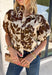 Classic florals and elevated details make this blouse a beautiful addition to your fall wardrobe. Designed with a cream backdrop and a rich brown floral print, this timeless top offers an effortlessly polished look that's perfect for both work and weekends. The stand neckline creates a refined silhouette, while the gleaming gold button-front closure adds an elegant finishing touch. 