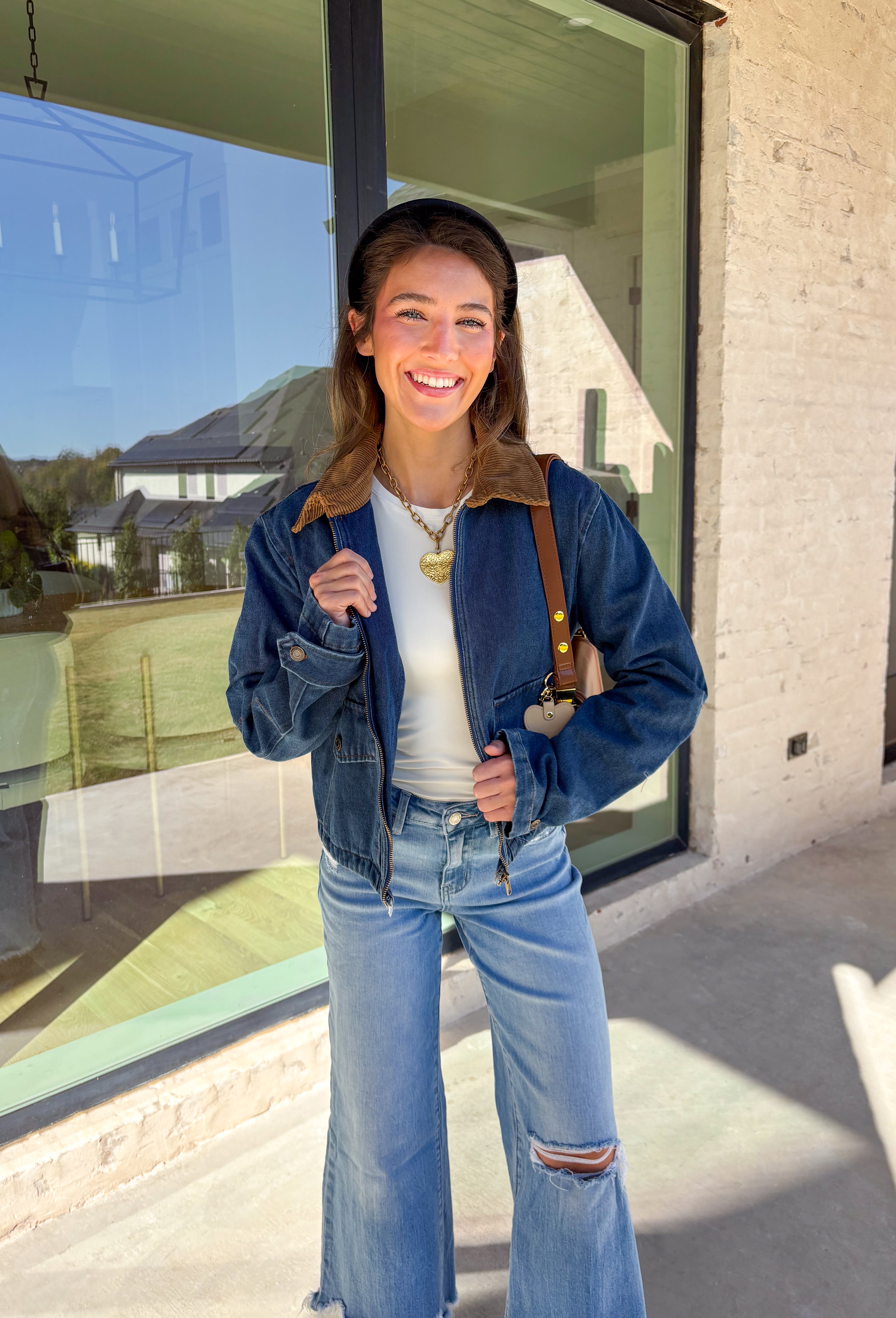 Classic and effortlessly cool, this denim barn jacket by Haute Monde is the perfect layer for the winter season. Featuring a soft brown corduroy collar and zip-front closure, it blends timeless design with everyday comfort. Functional front pockets and structured denim give it that lived-in look you’ll love for layering over your favorite winter sweaters or flannels.