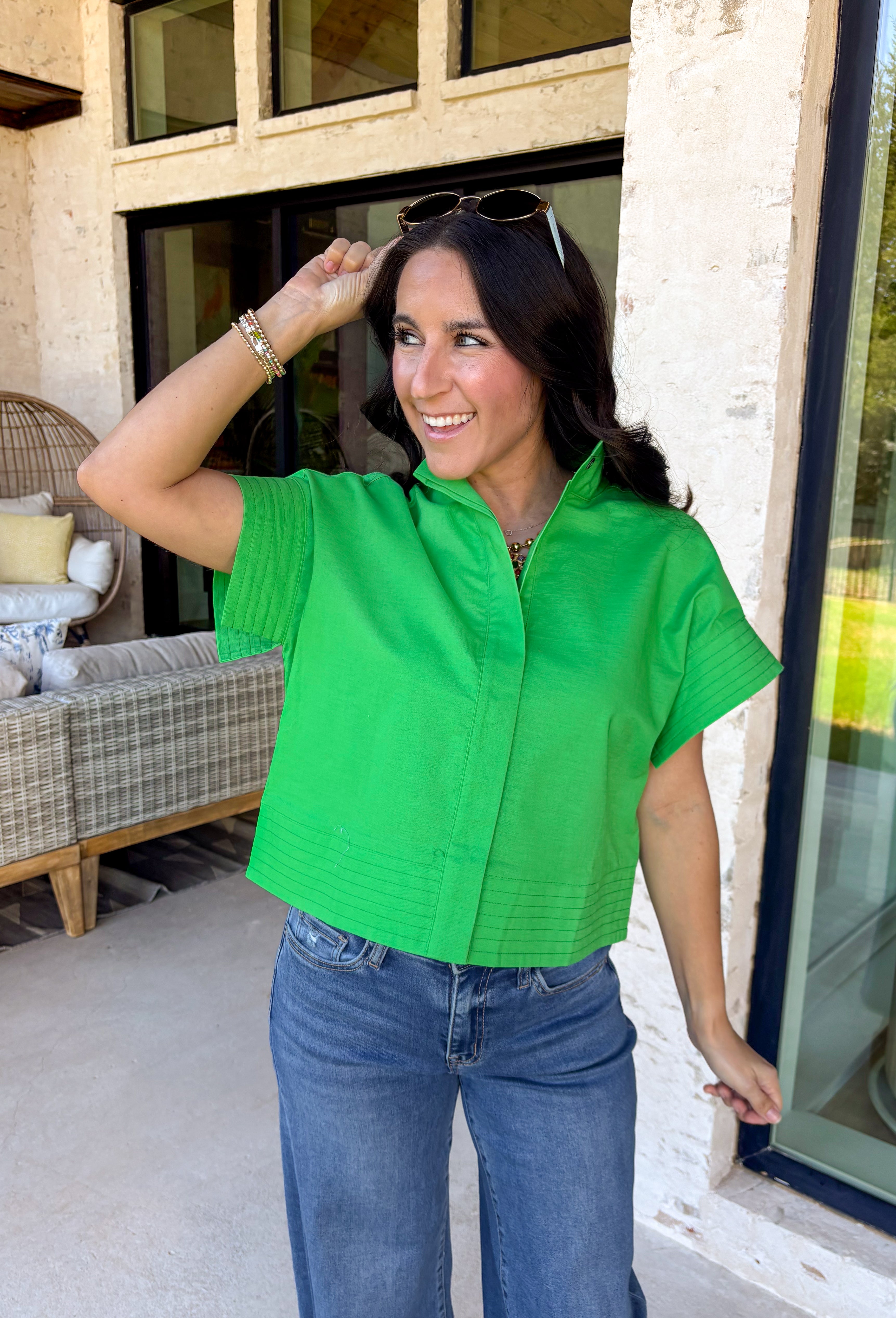 This kelly green short sleeve shirt is the kind of spring staple that instantly brightens up your whole outfit. The crisp color feels fresh and fun, while the hidden button down design keeps the look clean, polished, and effortlessly put-together. Made from a breathable cotton-linen blend, it’s lightweight enough for warmer days but still structured enough to wear to work, brunch, or wherever your calendar takes you. Just add denim and you’re good to go!