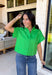 This kelly green short sleeve shirt is the kind of spring staple that instantly brightens up your whole outfit. The crisp color feels fresh and fun, while the hidden button down design keeps the look clean, polished, and effortlessly put-together. Made from a breathable cotton-linen blend, it’s lightweight enough for warmer days but still structured enough to wear to work, brunch, or wherever your calendar takes you. Just add denim and you’re good to go!