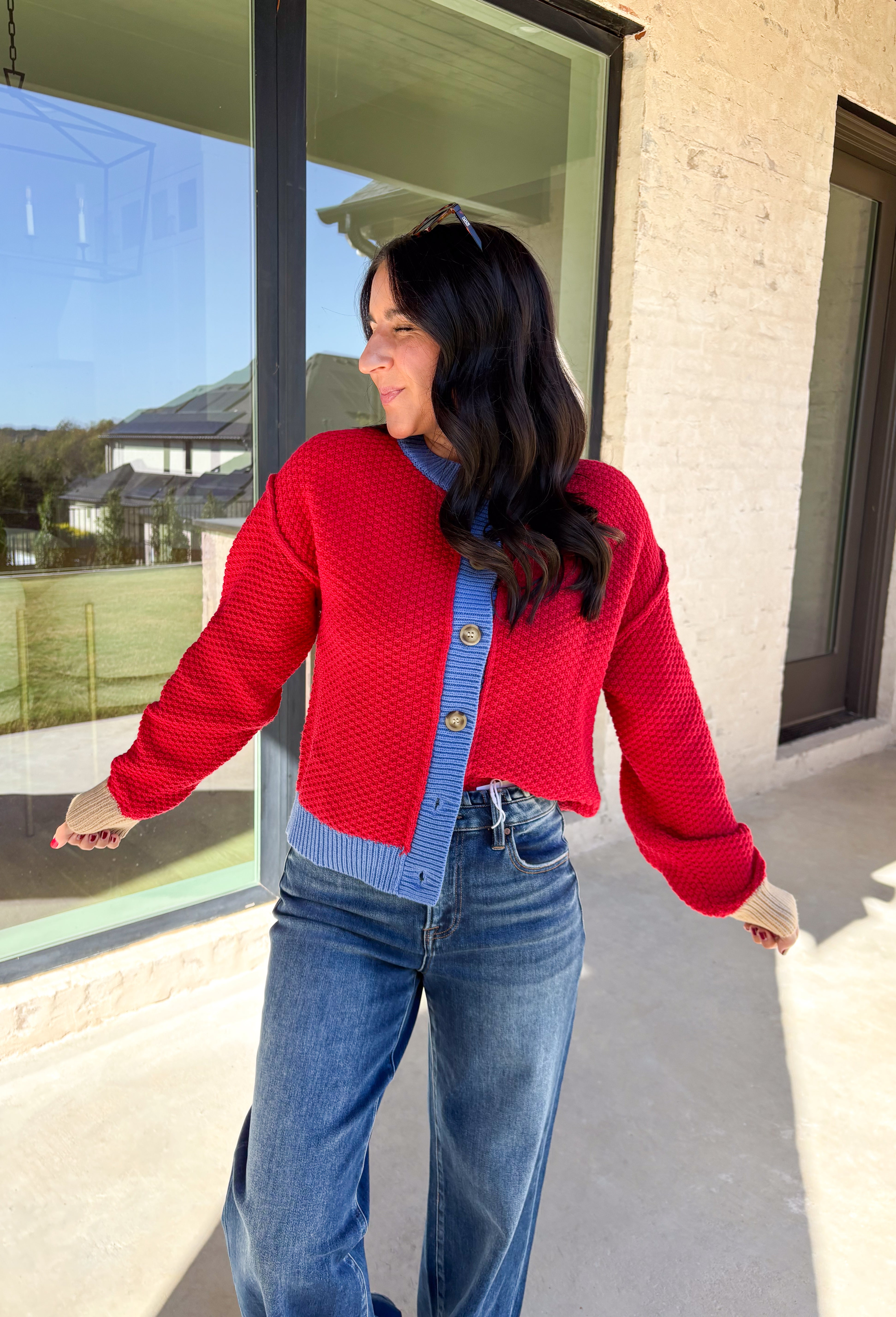 A cozy layering essential with a playful twist! This red knit button down cardigan features hints of periwinkle woven throughout for a fun pop of color, plus a contrasting tan trim on the sleeves for that little something extra. It’s the kind of cardigan you’ll reach for all season long—whether you're lounging or layering up for fall errands.