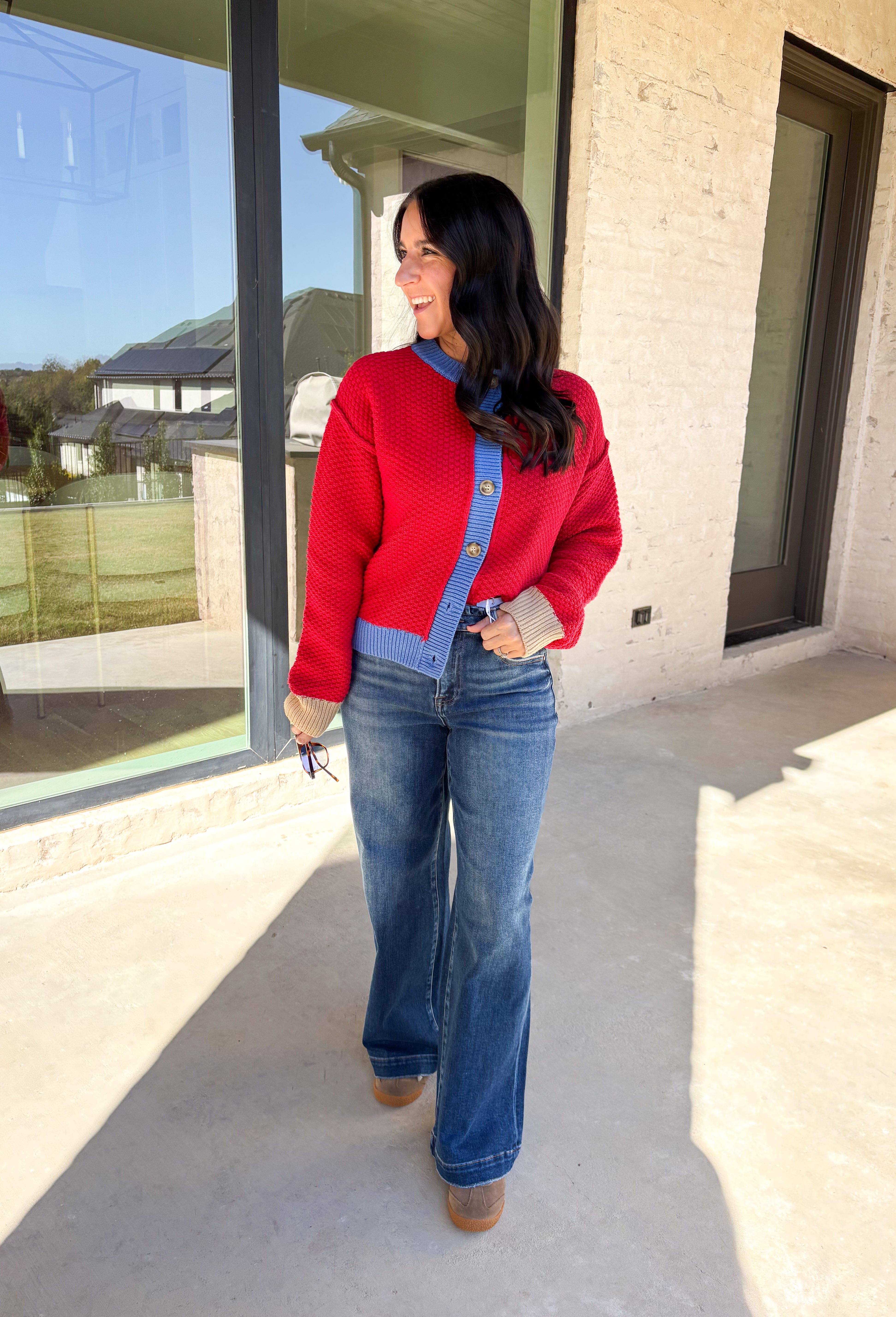 A cozy layering essential with a playful twist! This red knit button down cardigan features hints of periwinkle woven throughout for a fun pop of color, plus a contrasting tan trim on the sleeves for that little something extra. It’s the kind of cardigan you’ll reach for all season long—whether you're lounging or layering up for fall errands.