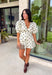 Classic polka dots and effortless style come together in this adorable two-piece set from Mable. Featuring an off-white and black polka dot print, this coordinating outfit is as versatile as it is charming. The short sleeve top is designed with feminine puff sleeves, a single button closure at the front, and a sweet tie detail at the back for an elevated finish. The matching shorts feature a comfortable elastic waistband, side zipper closure, and functional side pockets.